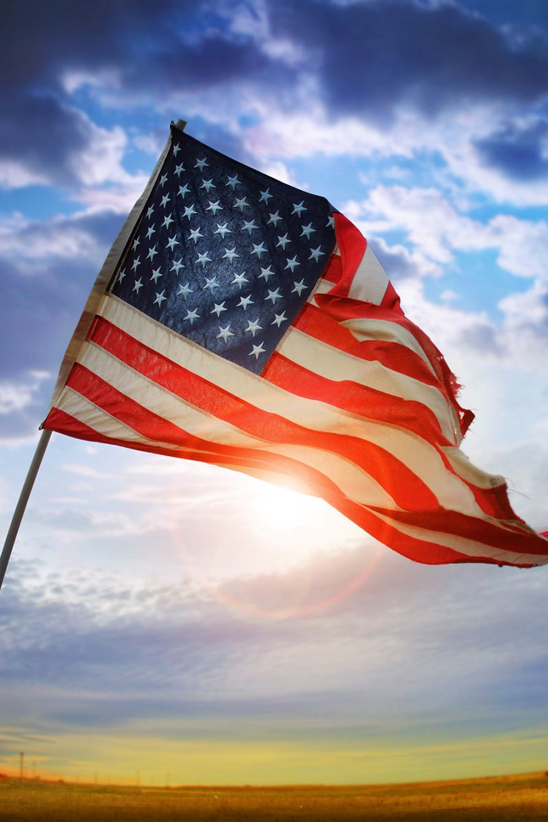 American Flag at sunset with sky